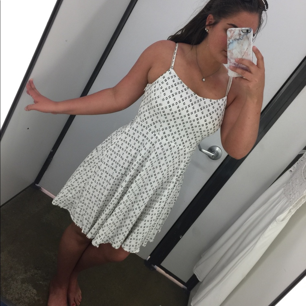 White sundress with navy blue patterns